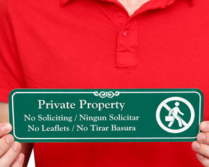 Bilingual no soliciting door sign