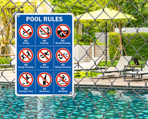 Pool rules sign on a portable base